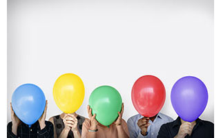 Different colored balloons covering faces